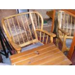 A rocking chair and a pine mirror together with a small table