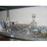 A quantity of Babycham glasses together with commemorative RAF glasses with decanter and figurines