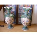 A pair of eastern Satsuma vases depicting an oriental scene