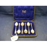 A cased set of silver golfing tea spoons