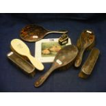 A set of faux tortoiseshell dressing table items to include brushes, mirrors etc.