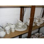 A quantity of Royal Doulton Tonkin together with a Paragon Athena coffee and tea service on two
