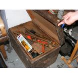 A wooden tool box containing a quantity of hand tools etc.