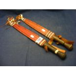 Two tribal knives in sheaths