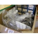 A carton of watch and clock spares