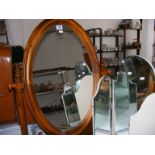 A pine oval dressing table mirror together with a folding mirror