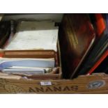 A carton containing 3 albums of first day covers together with a quantity of Stanley Gibbons the