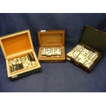 Two sets of Dominoes in three decorative trinket boxes