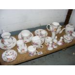 A collection of Royal Crown Derby Posys to include cups, saucers, jugs, cruet set and bell etc.