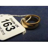 A 9ct gold wedding band together with a 22ct gold wedding band