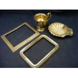 Two silver photo frames (a/f) together with a silver cup and a silver bon bon dish