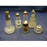 Six silver topped perfume bottles