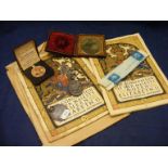 A mixed lot containing a silver locket, a silver sporting medal, coronation souvenir programmes etc.