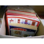 A carton containing a quantity of world stamps to include a very large empire postage stamp album,