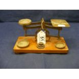 A set of brass postage scales