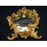 A continental Mirror adorned with Floral