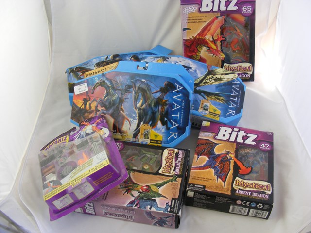 Three Avatar figure kits together with a