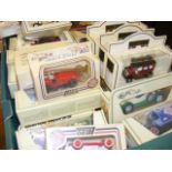 A carton containing 50 assorted boxed die cast vehicles to include Matchbox, Lledo etc.