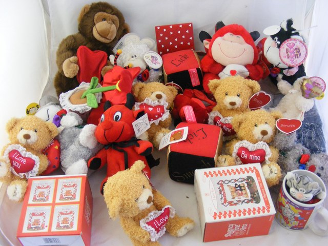 A large carton of assorted stuffed toys