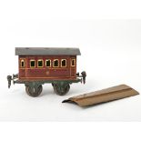 MÄRKLIN Abteilwagen, Anfang 20.Jh., rot-braun mit gelben Fenstern und Aufschrift II. 2-achsig.