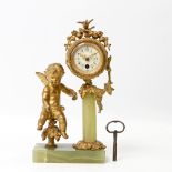 Feine Tischuhr, wohl Frankreich, um 1900, Metallguß. Auf Stand runde Uhr, bekrönt von Blüten und