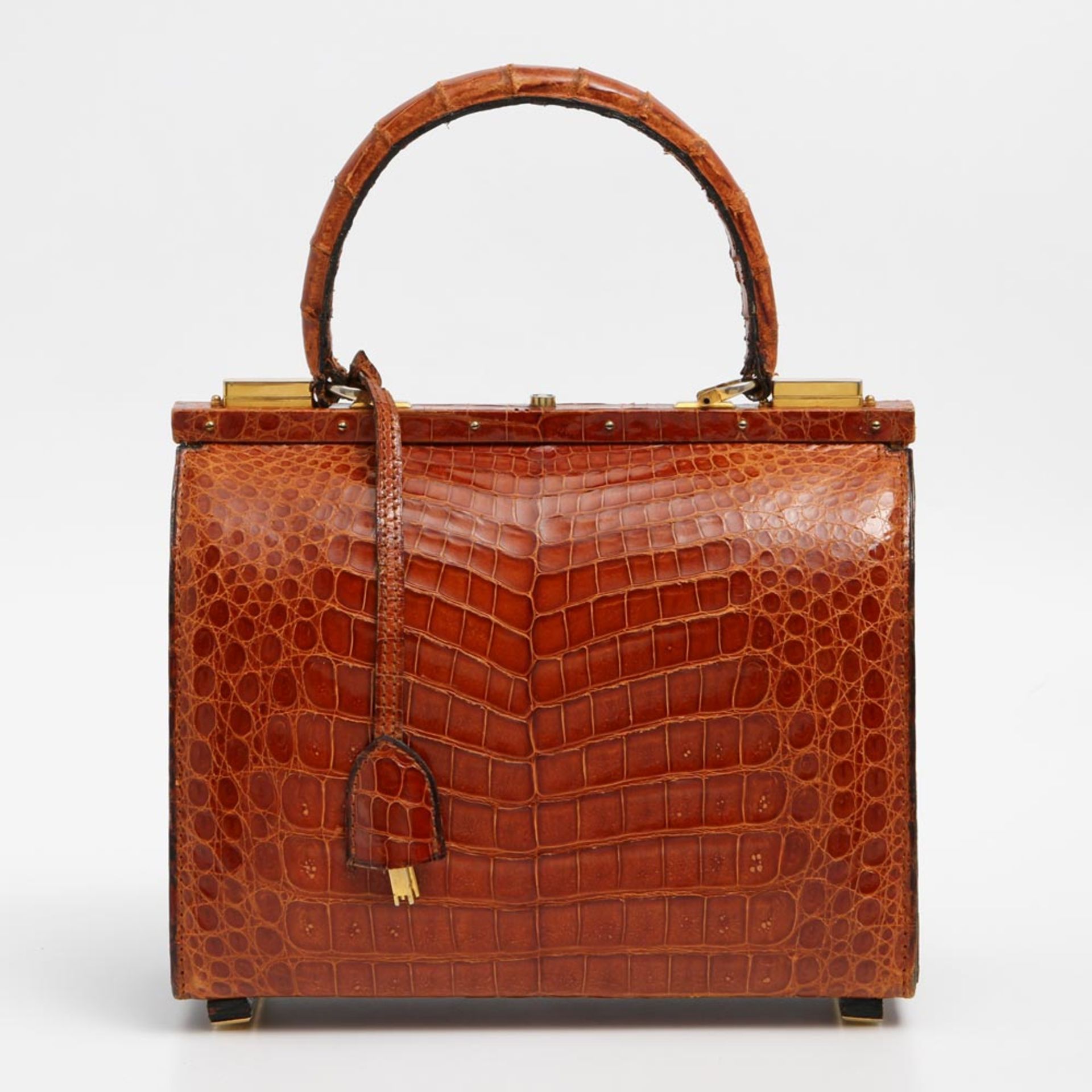 Aparte Krokodillederhandtasche, Herstellung: Mitte der 1960er Jahre. Orangebraunes Leder des