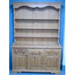 Pine dresser base with three drawers over cupboard doors 201cm x 142cm x 43cm