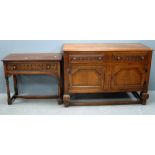 Oak sideboard with two drawers over two cupboard doors and a similar oak side table with single