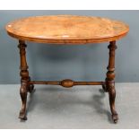 Victorian walnut oval inlaid table on twin end supports and scrolling feet (marriage)