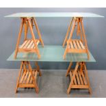 Two frosted glass topped trestle tables on light oak bases