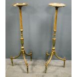 Pair of grey and gilt painted torcheres on tripod bases