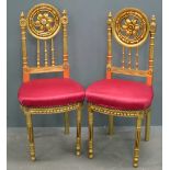 Pair of gilt decorated hall chairs with red upholstered seats