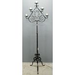 Black painted cast metal standard lamp