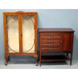 Walnut glazed display cabinet and a mahogany music cabinet