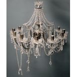 Metal twelve branch chandelier with cut glass drops