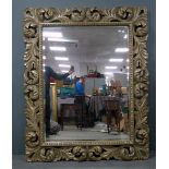 Large carved wood framed overmantel bevelled mirror