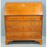 George III oak bureau on bracket feet