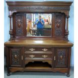 Early 20th century mahogany and mirror backed carved sideboard by M. D. MIller & Sons of Nottingham