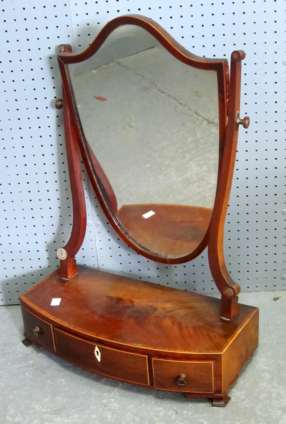 Mahogany shield shaped bedroom mirror, base with three drawers