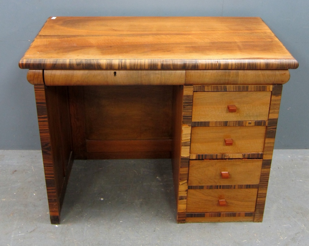 Coromandel veneered desk with four drawers