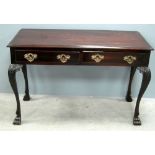 Early 20th century mahogany side table of two drawers, stamped M.Butler of Dublin, on carved