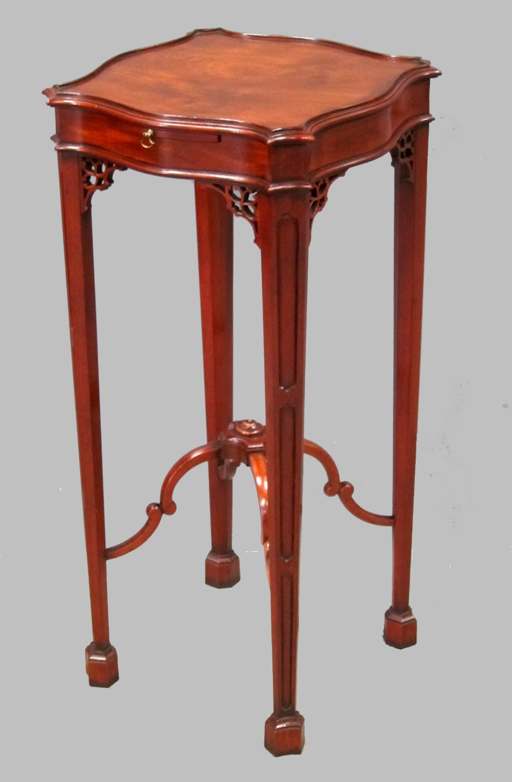 19th century style mahogany urn stand on square tapering legs to spade feet united by X Stretcher by