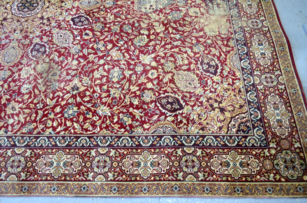 Large Persian red ground carpet with central shaped medallion and floral motifs, with multiple - Image 4 of 9