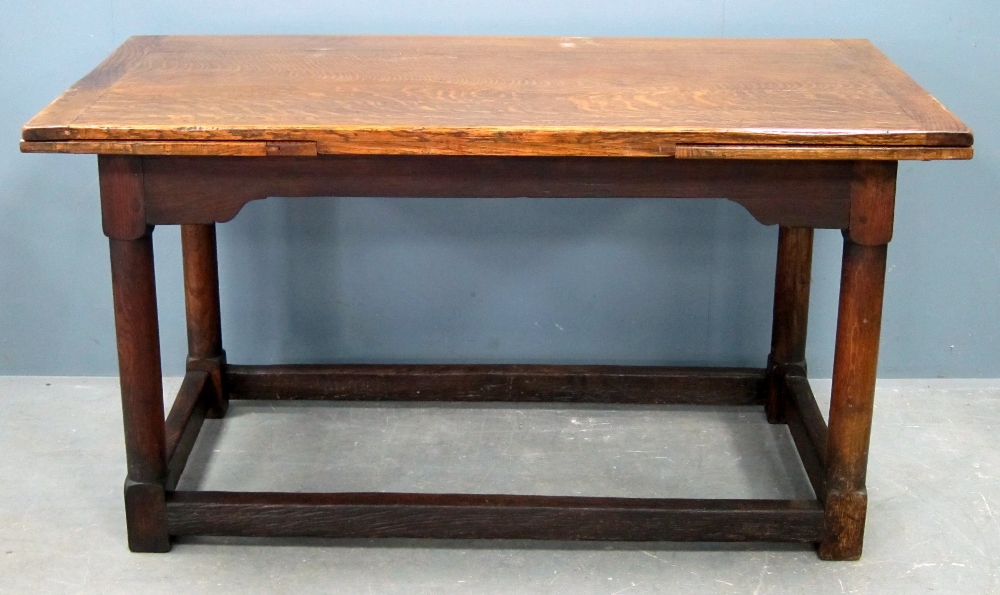 George III style  oak draw leaf table on turned supports and stretchered base, with some later