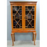 Walnut astragal glazed bookcase with two doors on stand with front cabriole legs 185cm x 102cm x