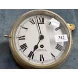 Smith brass cased wall clock 	 Is ticking okay, the sides are brass, Can be screwed to a wall.