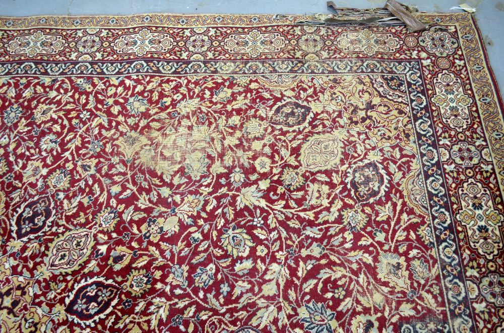 Large Persian red ground carpet with central shaped medallion and floral motifs, with multiple - Image 5 of 9