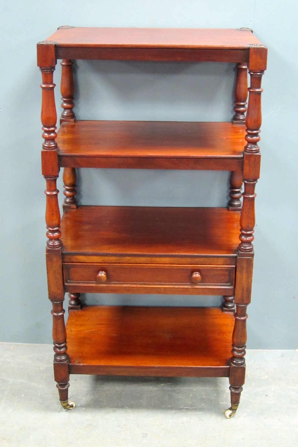 19th century mahogany four tier what not, with a single drawer on turned supports to castors, - Image 2 of 2