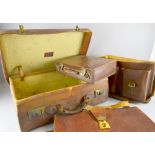 Leather suitcase and another and two leather satchels