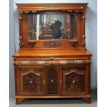 Walnut mirror backed sideboard with two drawers over two cupboard doors